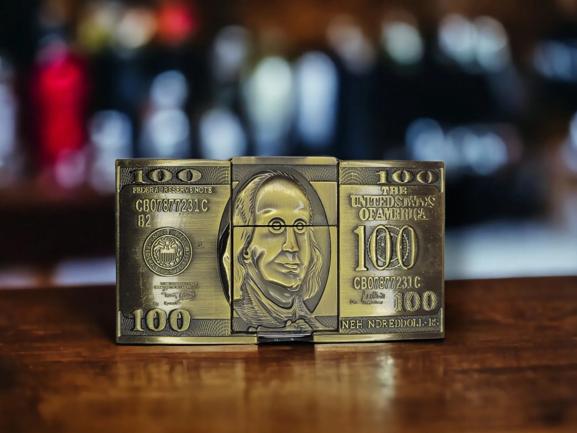 100 Dollars Benjamin Franklin Lighter Belt Buckle Holder in a Bronze finish.