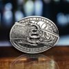 “Folding Knife Belt Buckle with Don't Tread On Me Symbol and concealed knife access.