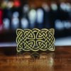 Rectangular silver Celtic knot belt buckle crafted from durable metal alloy, designed for 1.5-inch belts with intricate Celtic-inspired detailing.