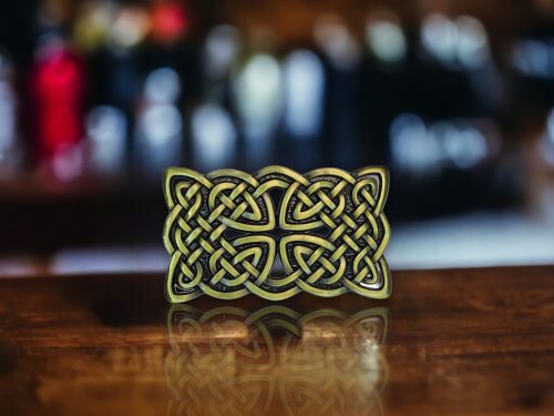 Rectangular silver Celtic knot belt buckle crafted from durable metal alloy, designed for 1.5-inch belts with intricate Celtic-inspired detailing.