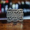 Celtic pattern belt buckle with a five-point star design, crafted from high-quality metal alloy, fitting 1.5-inch belts with smooth, rounded edges.
