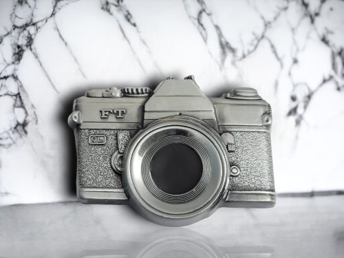 Vintage silver belt buckle featuring a 3D camera design with intricate antique-inspired detailing.