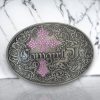 Oval silver belt buckle with pink rhinestones and a turquoise centerpiece, designed for 1.58-inch belts.