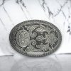 Vintage silver oval belt buckle with a brushed silver finish, perfect for cowgirl-inspired outfits.