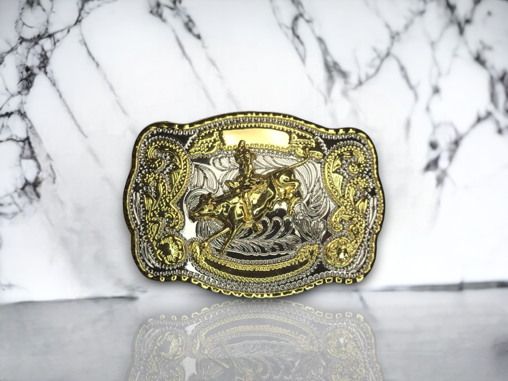 Bull Rider Rodeo belt buckle with gold and silver finish, featuring intricate bull rider artwork and a classic Western design.