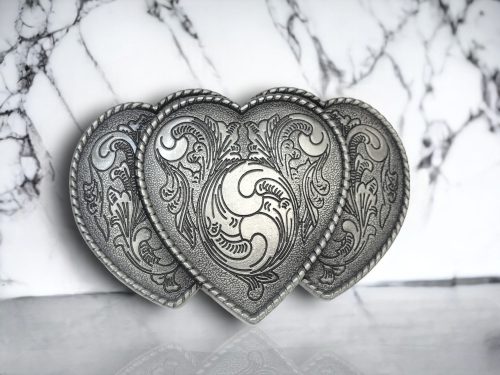 riple Heart belt buckle with a silver finish,