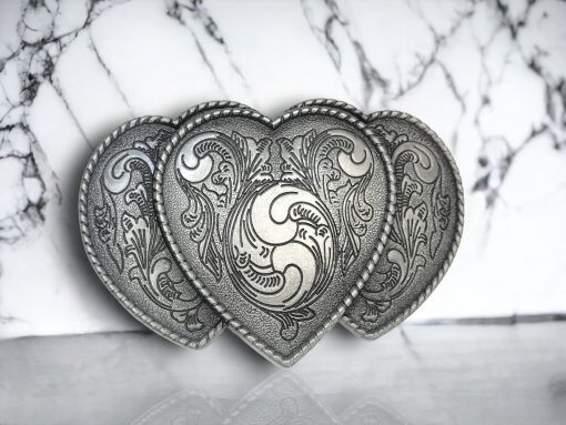 riple Heart belt buckle with a silver finish,