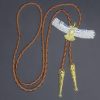 Two-tone gold and silver American eagle bolo tie with braided leather cord, metal tips, and an adjustable slider clasp.