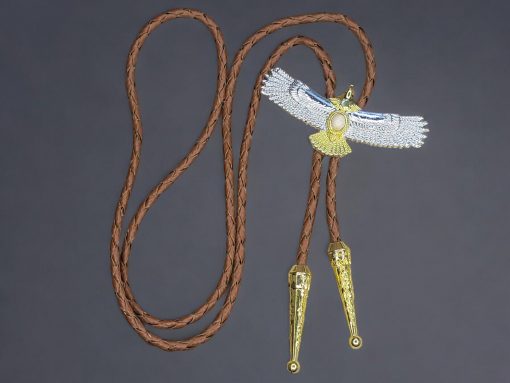 Two-tone gold and silver American eagle bolo tie with braided leather cord, metal tips, and an adjustable slider clasp.