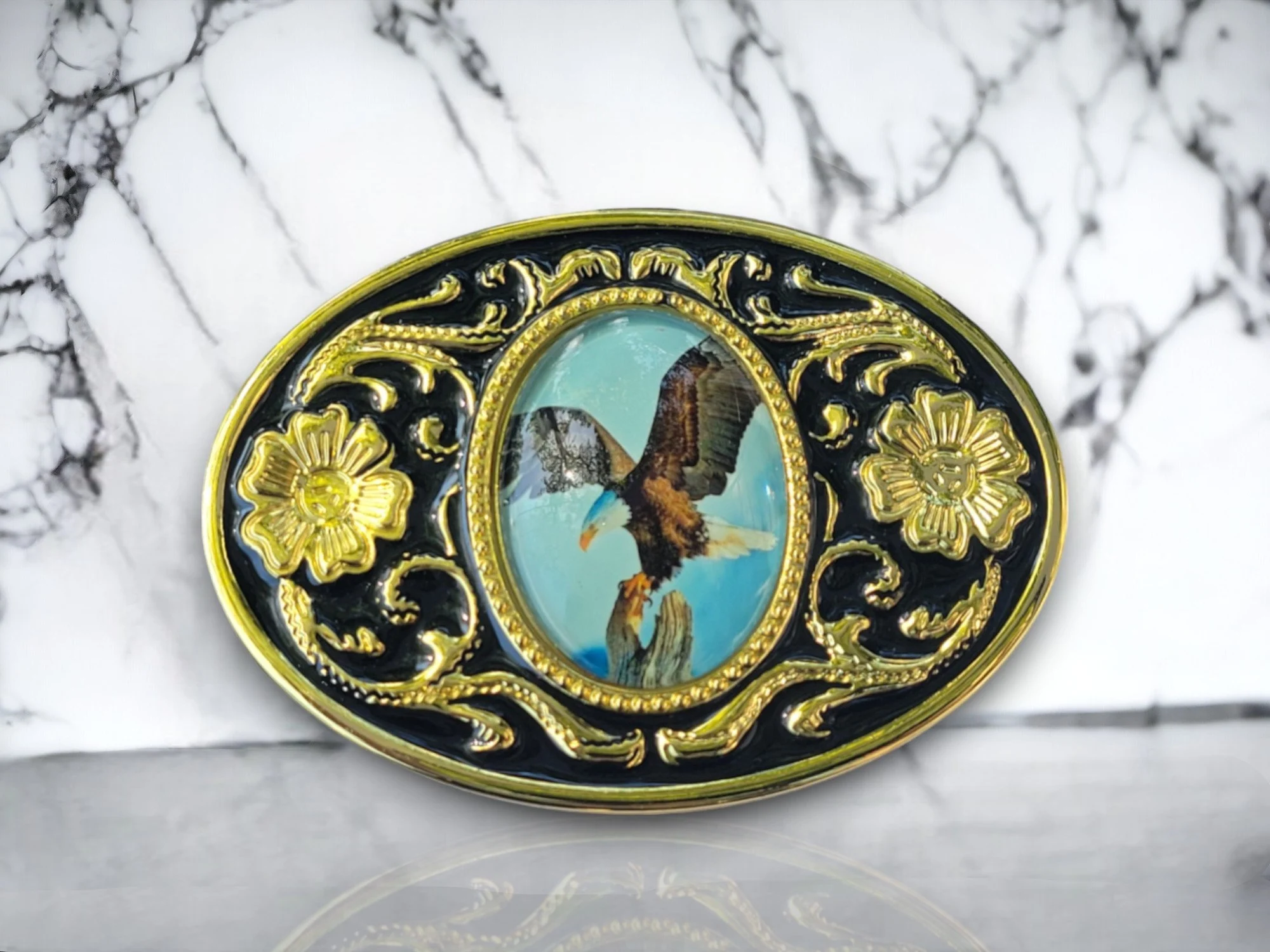 Western belt buckle with American Bald Eagle design in gold and black enamel, crafted from durable metal alloy for a bold and patriotic look.