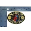 Western-style horse head belt buckle with gold and black enamel floral accents and an abalone shell centerpiece.