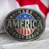 Silver-tone MAGA belt buckle with an American flag design, perfect for patriotic and Western wear.