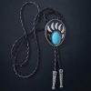 Western-style bear claw bolo tie with turquoise gemstone, braided leather cord, and metal tips.
