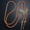 American eagle bolo tie with braided leather cord and metal tips
