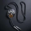 Western-style bear claw bolo tie with a tiger eye gemstone, braided leather cord, and metal tips.