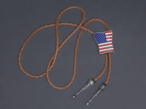 Western-style bolo tie with American flag design, braided leather cord, and metal tips.