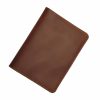 Light brown leather passport cover with card slots, hidden pocket & free custom engraving—durable & stylish for global travelers.