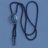 Southwestern bolo tie with large silver pendant and cabochon turquoise on braided leather cord